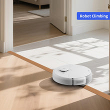 Load image into Gallery viewer, Robot vacuum cleaner climbing over a low doorway threshold using a slim PVC rubber transition ramp between tiled and wooden floors