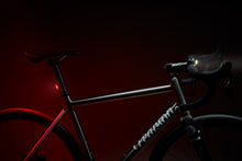 Load image into Gallery viewer, Bicycle with a red bike rear light