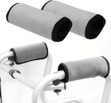 Load image into Gallery viewer, Two black padded walker handle cushion covers displayed side by side, designed to fit standard rollator, walker, and wheelchair handles, featuring soft high-density foam padding and secure wrap-around fastening.