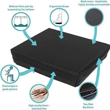 Load image into Gallery viewer, Wheelchair seat cushion with ergonomic contouring and labelled benefits, including sciatica relief, suspended tailbone area, washable zip cover, and high-density foam.