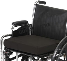 Load image into Gallery viewer, Black orthopaedic wheelchair seat cushion placed on a standard wheelchair, showing thick padded design for pressure relief and lower back support.