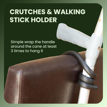 Load image into Gallery viewer, Crutch and walking stick holder wrapped around cane and chair for secure hanging