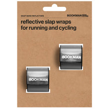 Load image into Gallery viewer, Bookman black reflective slap wraps for running and cycling displayed in original cardboard packaging.