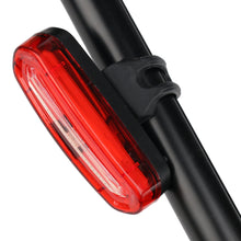 Load image into Gallery viewer, USB-rechargeable waterproof LED bike rear light for night riding, multiple modes, wide-angle visibility.