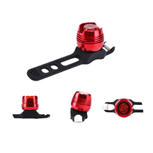 Load image into Gallery viewer, CushBike 300‑Lumen rechargeable bicycle tail light mounted on a seatpost — bright LED, waterproof aluminium body, quick‑release strap for bike, helmet or backpack