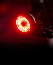 Load image into Gallery viewer, Black replacement mounting bracket attached to a bicycle handlebar, holding CushBike Flare Recon LED light and waterproof powerbank.
