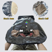 Load image into Gallery viewer, Transparent rain guard installed on a mobility scooter control panel, highlighting the elastic hem and stretchable fabric cuffs that help block rain and wind while keeping buttons, display lights, and keys visible.
