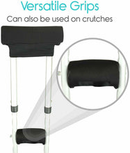 Load image into Gallery viewer, Soft padded grip covers wrapped around crutch handles, showing secure fastening system and added cushioning to reduce hand pressure and fatigue.
