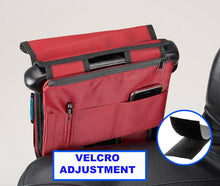 Load image into Gallery viewer, Red mobility scooter pannier bag with adjustable Velcro fastening attached to armrest.
