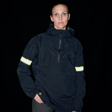 Load image into Gallery viewer, Person wearing Bookman fluorescent yellow reflective bands on both arms for enhanced visibility in low-light conditions.

