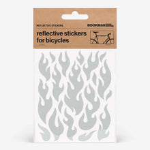Load image into Gallery viewer, Bookman white reflective flame stickers for bicycles shown on a packaging sheet.
