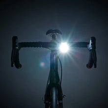 Load image into Gallery viewer, Bookman Curve Front Bike Light illuminating the road during night cycling
