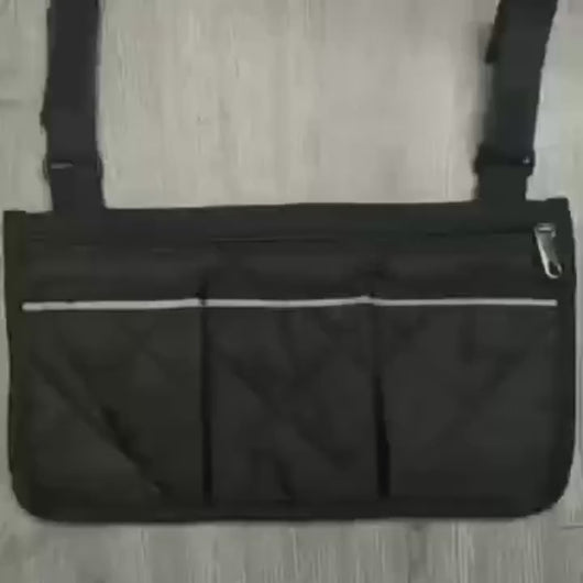 Video showing side armrest bag with reflective strip attached to a wheelchair for easy-access storage