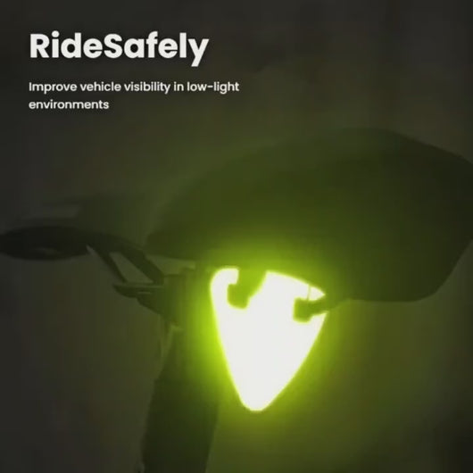Demo video showing high-visibility orange reflective bicycle pendant being attached to a bike and glowing in low light.