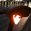 Orange bike pendant on a road bike for improved visibility