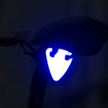 Load image into Gallery viewer, High-visibility orange reflective bicycle pendant attached to a mountain bike frame
