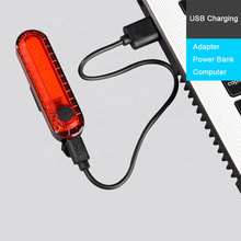 Load image into Gallery viewer, CushBike Bright Bicycle Rear Light – ultra‑bright 50 lumen 5‑LED tail light with USB rechargeable battery and IPX4 waterproof body, designed for seatpost or helmet mounting.
